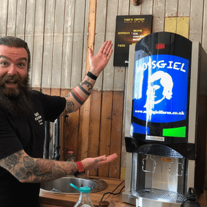 Picture of Ross with his new Milk dispensing machine.