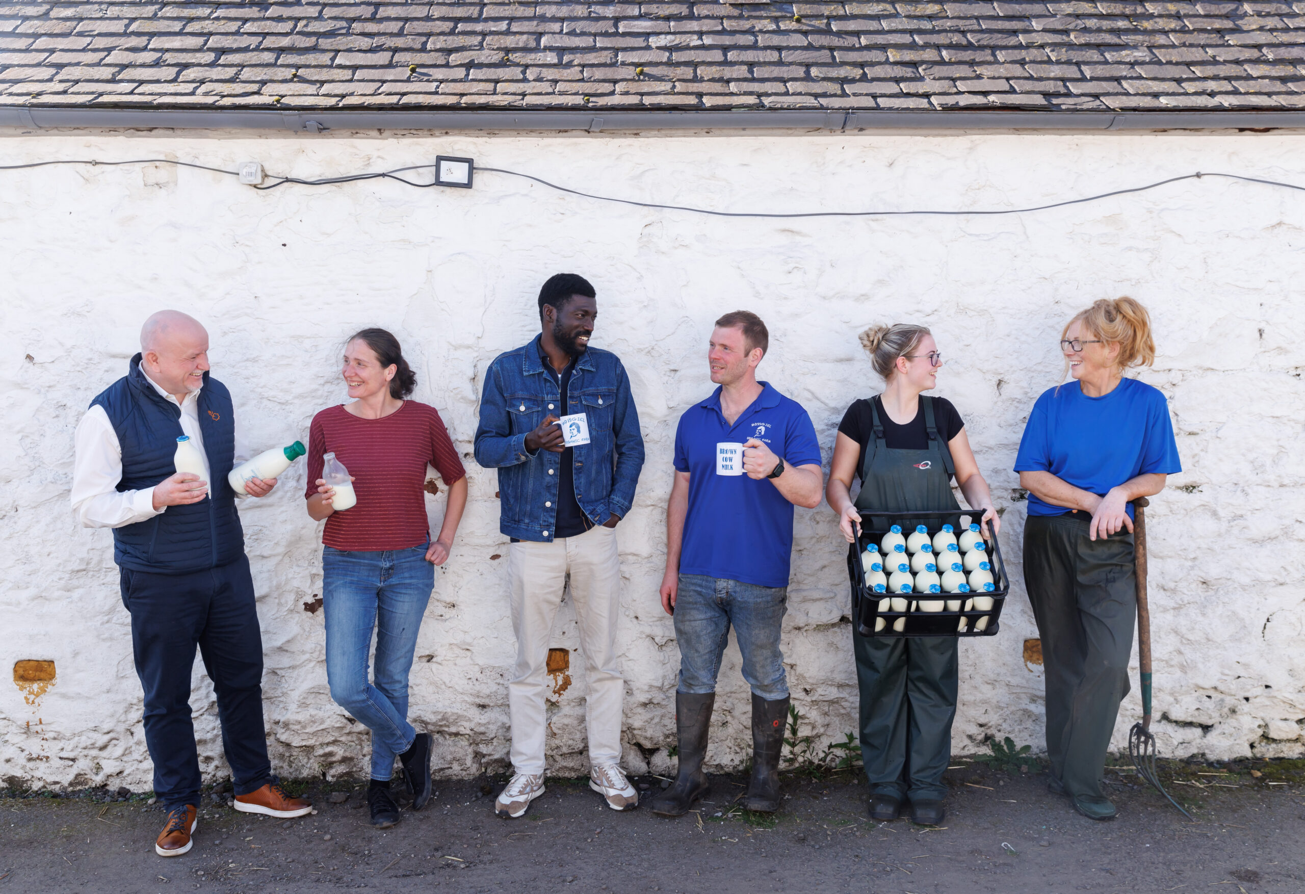 The Mossgiel team with bottles of organic milk at the farm